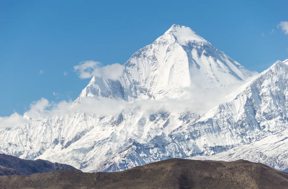 Snow-covered Dhaulagiri beneath a clear sky in Nepal
